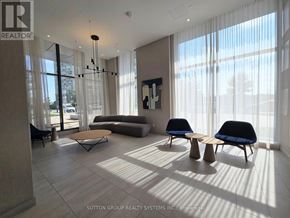 Toronto (Islington-City Centre West) condo for rent - A living room with a couch, chairs, and a large window.