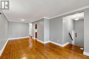 Newmarket (Bristol-London) apartment for rent - A spacious room with wooden floors and white walls.