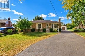 St. Catharines (Lakeport) apartment for rent - A house with a driveway in front of it.