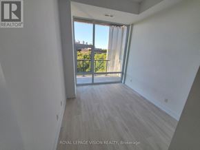 Toronto (Bayview Village) condo for rent - A room with a sliding glass door leading to a balcony.