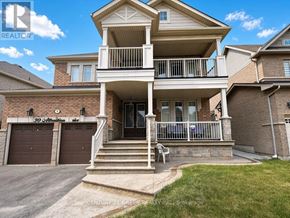 Brampton (Bram West) apartment for rent - A two-story house with a balcony and a garage.