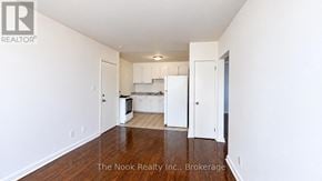 Oshawa (Lakeview) apartment for rent - A white kitchen with a refrigerator, microwave, and oven.