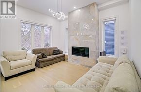 Toronto (Cliffcrest) apartment for rent - A living room with a fireplace and a couch.