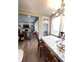 Surrey apartment for rent - A bedroom with a large bed and a fireplace.