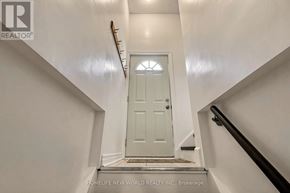 Newmarket (Bristol-London) apartment for rent - A white door is at the end of a staircase.