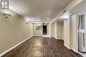 Newmarket (Bristol-London) apartment for rent - A hallway with wood flooring and white walls.