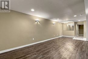 Newmarket (Bristol-London) apartment for rent - A room with wooden flooring and white walls.