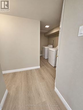 Aurora (Aurora Highlands) apartment for rent - A room with light wood flooring and white walls.