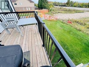 London South (South W) townhouse for rent - A wooden deck with a bench and a table.