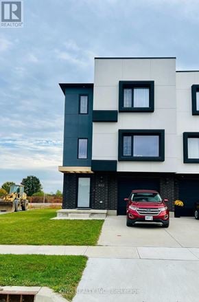 London South (South W) townhouse for rent - A modern two-story house with a red car parked in front.