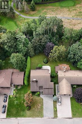 Sault Ste. Marie apartment for rent - A bird's eye view of a residential area with houses and trees.