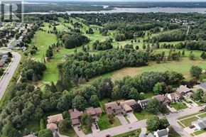 Sault Ste. Marie apartment for rent - A bird's eye view of a residential area with houses and greenery.