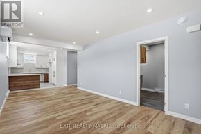 Hawkesbury apartment for rent - A room with wooden flooring and a white door.