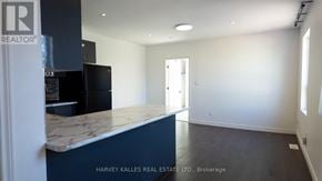 Toronto (Humewood-Cedarvale) multi-family for rent - A real estate listing photo of a room with a marble counter.