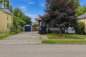 London East (East G) apartment for rent - A residential area with a house, a tree, and a car.