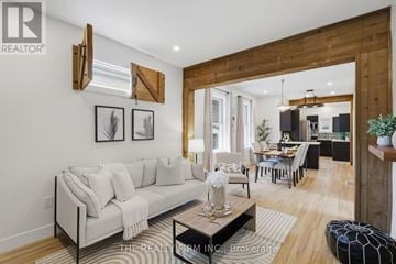 London East (East G) apartment for rent - A modern living room with a large couch and a coffee table.