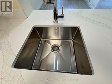 Toronto (Lansing-Westgate) condo for rent - A modern kitchen sink with a chrome finish and a single faucet.