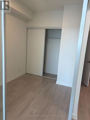 Mississauga (Lakeview) condo for rent - A room with a white door and a wooden floor.