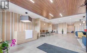 Kitchener condo for rent - A modern office space with wooden accents and a reception desk.