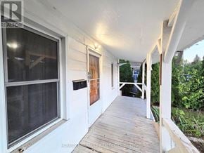 Windsor apartment for rent - A white house with a porch and a window.
