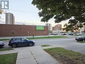 Windsor apartment for rent - A Food Basics store is located in a city setting.