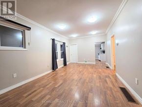 Windsor apartment for rent - A room with wooden flooring and a window with curtains.