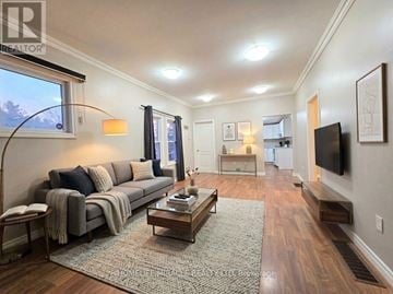 Windsor apartment for rent - A living room with a grey couch and a coffee table.