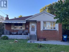 Toronto (Birchcliffe-Cliffside) apartment for rent - A small house with a front porch is for sale.