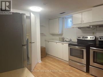 Toronto (Agincourt South-Malvern West) apartment for rent - A kitchen with white cabinets and stainless steel appliances.