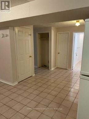 Mississauga (East Credit) apartment for rent - A room with tile flooring and white walls.