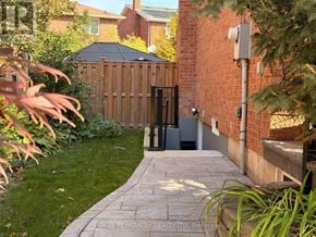 Brampton (Heart Lake West) apartment for rent - A garden with a stone pathway leading to a gate.