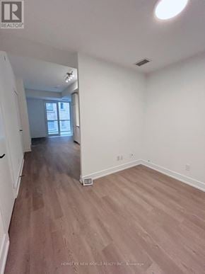 Toronto (Church-Yonge Corridor) condo for rent - A room with white walls and wooden flooring.