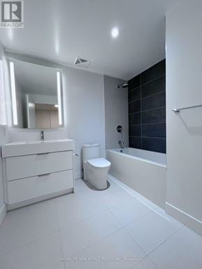Toronto (Church-Yonge Corridor) condo for rent - A white bathroom with a toilet, sink, and bathtub.
