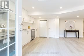 Richmond Hill (Jefferson) apartment for rent - A modern kitchen with white cabinets and a wooden floor.