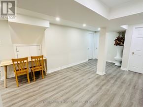 Markham (Raymerville) apartment for rent - A room with a whiteboard, two chairs, and a table.