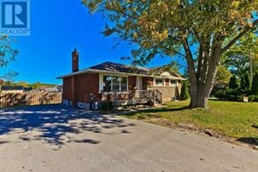 St. Catharines (Glendale/Glenridge) apartment for rent - A house with a tree in front of it.