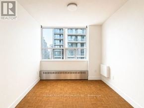 Toronto (Church-Yonge Corridor) condo for rent - A room with a window showing a building outside.