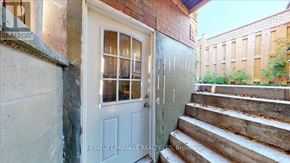Mississauga (East Credit) townhouse for rent - A white door with a glass window is the main focus of the image.