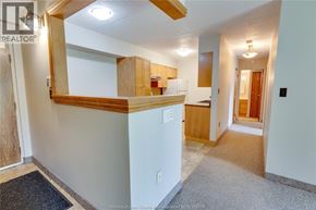 Windsor condo for rent - A room with a wooden counter and a mirror on the wall.