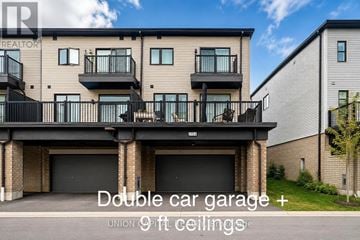 Oshawa (Samac) townhouse for rent - A building with a double car garage and 9 ft ceilings.