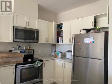 St. Catharines (Oakdale) townhouse for rent - A kitchen with a stove, oven, and refrigerator.