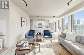 Toronto (Moss Park) condo for rent - A living room with a sofa, two chairs, and a coffee table.