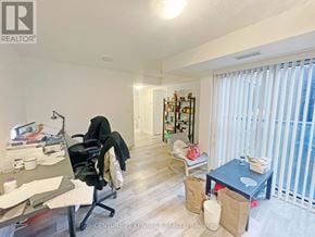 Toronto (Kensington-Chinatown) condo for rent - A room with a desk, chair, and a bookshelf.