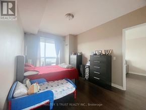 Toronto (Downsview-Roding-Cfb) condo for rent - A bedroom with two beds and a dresser.