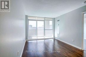 Mississauga (Hurontario) condo for rent - A room with a large window and wooden flooring.