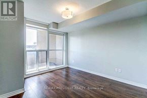 Mississauga (Hurontario) condo for rent - A room with a window and a wooden floor.