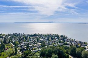 Surrey apartment for rent - A small town is situated on a hill overlooking a large body of water.