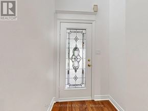 Newmarket (Summerhill Estates) apartment for rent - A white door with a glass panel and a gold handle.