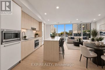 Ottawa condo for rent - A modern kitchen with a dining area in a real estate brokerage.