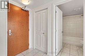Ottawa condo for rent - A brokerage sign is on the door of a small bathroom.